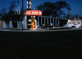 A Sign Lit Up At Night