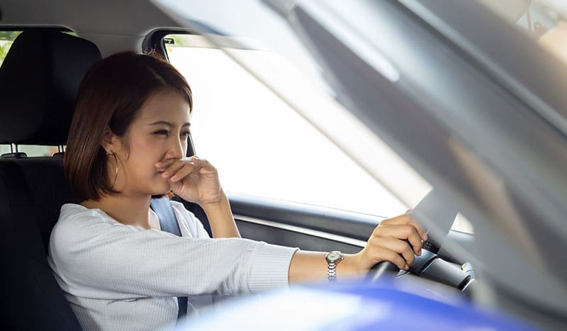 a person sitting in a car